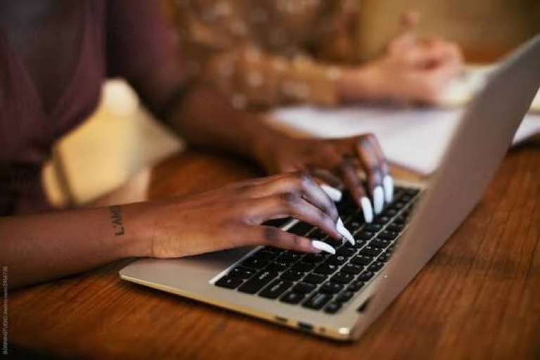 Someone accessing their housing online account using a laptop
