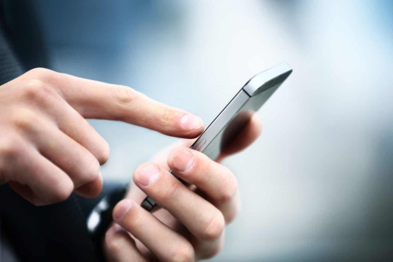 Someone accessing their benefits account using a mobile phone