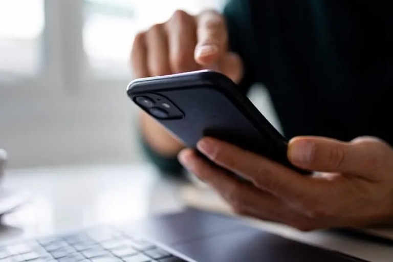 Someone accessing their business rates using a mobile phone